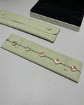 Van Cleef & Arpels Alhambra 5-motif bracelet featuring laser-engraved and mixed-color clover motifs.